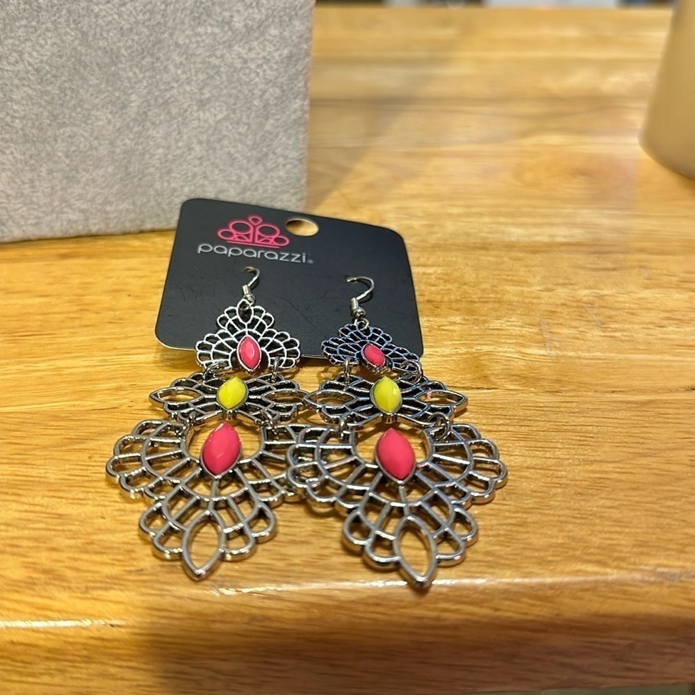 Very beautiful paparazzi brand new earrings. Silver with pink and yellow​​